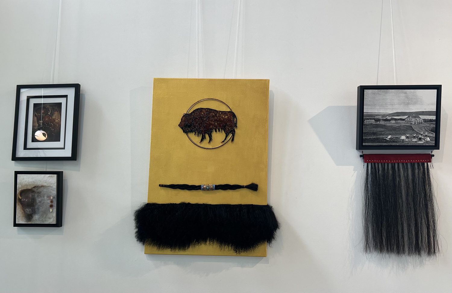 Mixed-media wall pieces including a beaded buffalo on gold