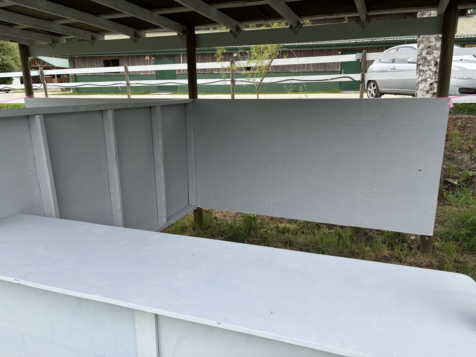 Close-up of the interior of a single stall, showing the counter and back wall